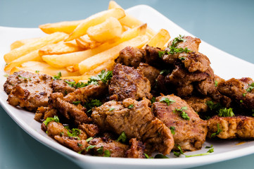 Grilled meat with French fries