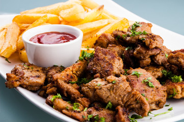 Grilled meat with French fries