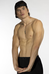 Fototapeta premium Naked waist young athlete with sporty cap