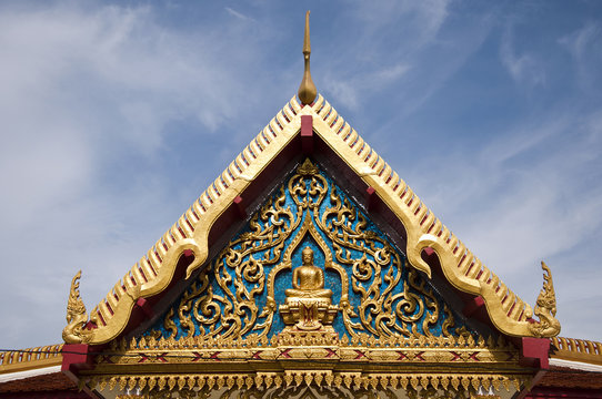 Gable of the church is decorated with images of buddha