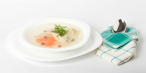 Tasty chicken clear soup with hen wing in plate