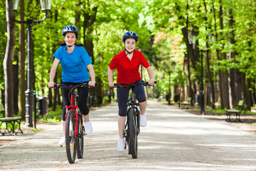 Fototapeta premium Girls riding bikes