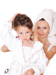 Mother styling girl's hair