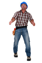 Naklejka premium Grimacing workman isolated on white background