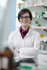 pharmacist chemist woman standing in pharmacy drugstore