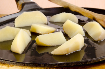 Potato wedges are fried with olive oil