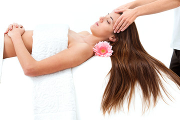 Obraz na płótnie Canvas Young woman having head massage.