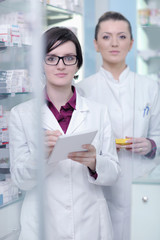 team of pharmacist chemist woman  in pharmacy drugstore