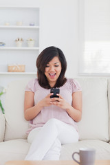 Woman surprised while looking at a phone