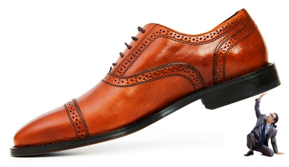 Woman domination concept with shoes and man