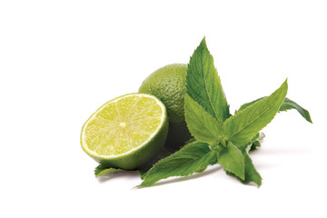 Lime with leaves on a white background