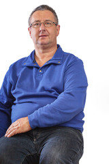 Fototapeta premium Seated man with glasses