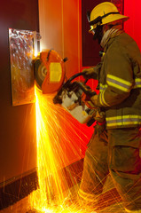Fireman cutting through door - 41423953