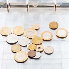 numismatics album with different coins