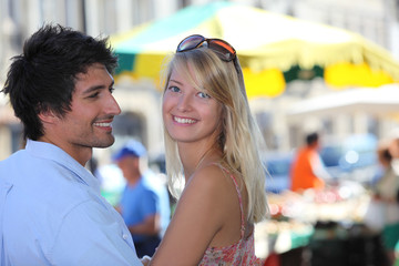 Couple shopping at market