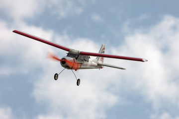 Naklejka premium RC model airplane flying in the blue sky