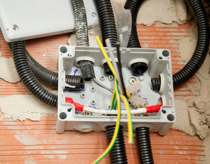 electrical coil conduit pipe on box embedded in wall