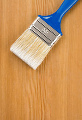 paintbrush on wood background