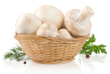 mushrooms and basket with spices isolated on white
