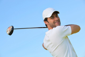 Man playing golf