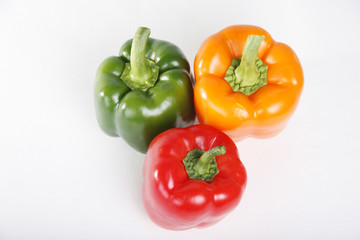 Top view of  red green yellow peppers