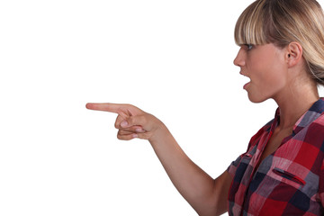 gorgeous blonde in profile pointing at something