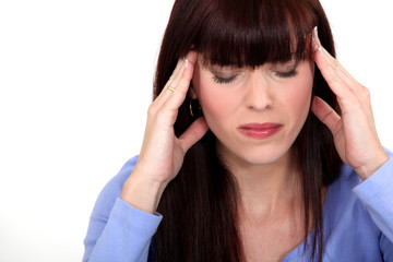 portrait of young woman having headache