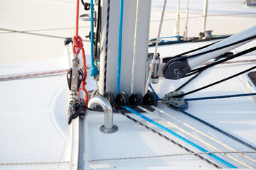Detail of sailboat mast bottom with ropes