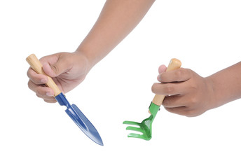 two hands holding garden tools
