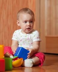 tranquil baby  plays with toys