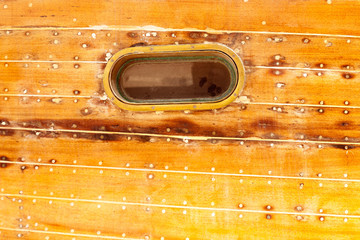 boat oval porthole in wooden hull