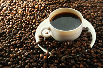 Espresso cup with coffee beans