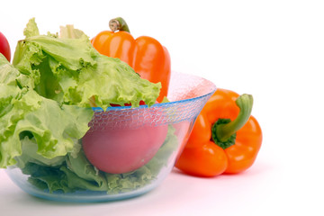 lettuce with red and fresh tomatoes isolated on white background