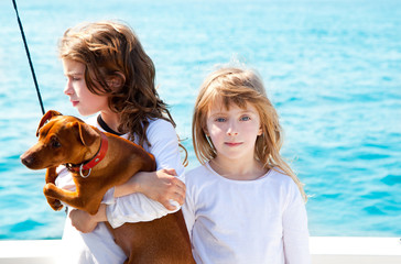 sister kid girls with dog on the sea