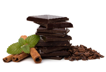 Chocolate bars stack and cinnamon sticks