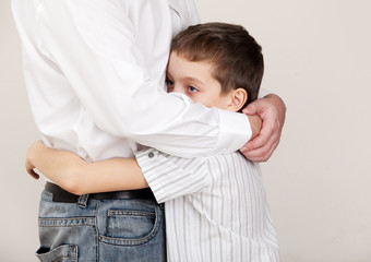 Father comforts a sad child