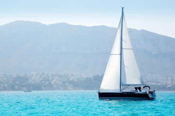 sailboats sailing in mediterranean sea