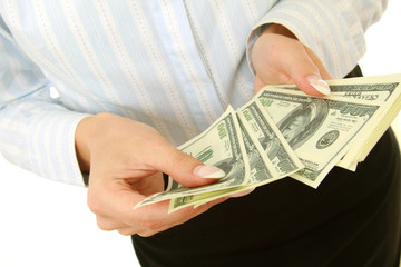 Closeup of dollars in female hands, isolated on white