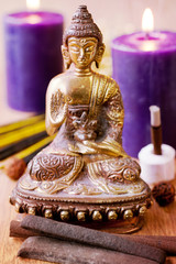 Statue of Buddha, incense, candles and rudraksha