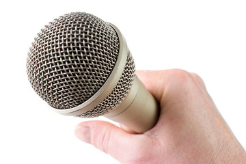 Audio microfone in hand, isolated on white