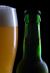 glass of beer with bottle