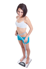 Fototapeta premium Woman standing on scales