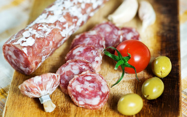 Sausage, tomato, garlic and olive