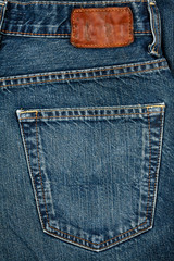 Blue jeans fabric with pocket and label