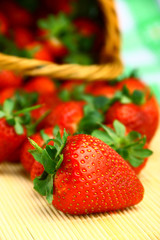 Delicious strawberries in wicker brown basket