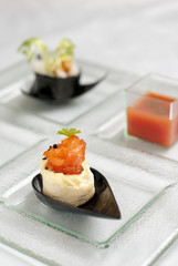 Selection of entrees with salmon creation in foreground.