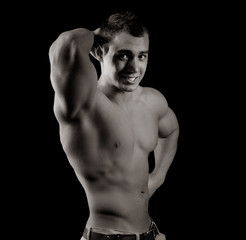 Bodybuilder showing his muscles
