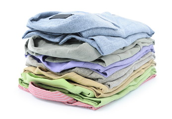 Stack of shirts in different colors isolated on white