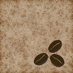 Obraz premium three coffee beans on light brown background