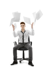 Young man throwing paper